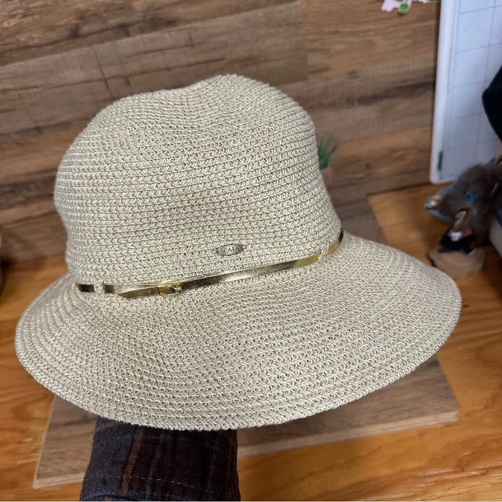 Scala women’s handwoven sun hat gold thread with a buckle trim